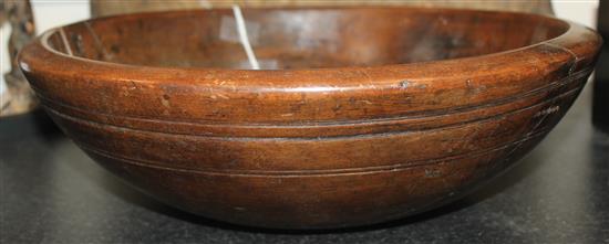 A 19th century turned fruitwood bowl, 14.25in.